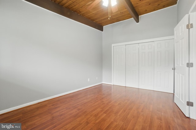 4379 Americana Dr Unit 201, Annandale, VA 22003 - unfurnished bedroom with wood ceiling with exposed beams, wood finished floors, baseboards, and a closet