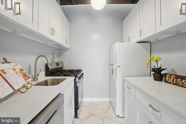 4379 Americana Dr Unit 201, Annandale, VA 22003 - kitchen featuring light marble finish flooring, appliances with stainless steel finishes, a sink, and white cabinets