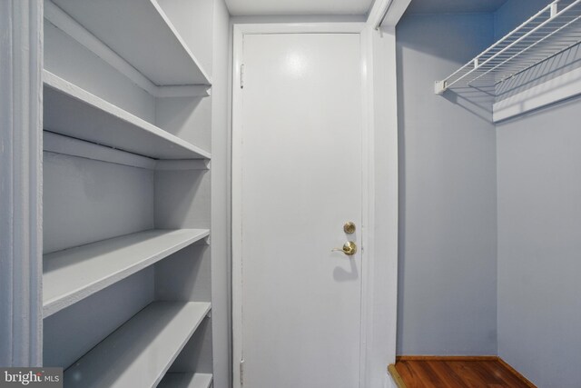 4379 Americana Dr Unit 201, Annandale, VA 22003 - walk in closet with wood finished floors