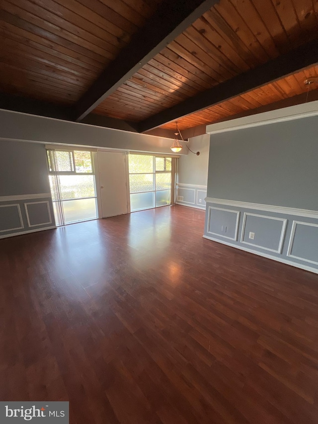 4379 Americana Dr Unit 201, Annandale, VA 22003 - empty room featuring a decorative wall, wooden ceiling with exposed beams, plenty of natural light, wood finished floors, and wainscoting
