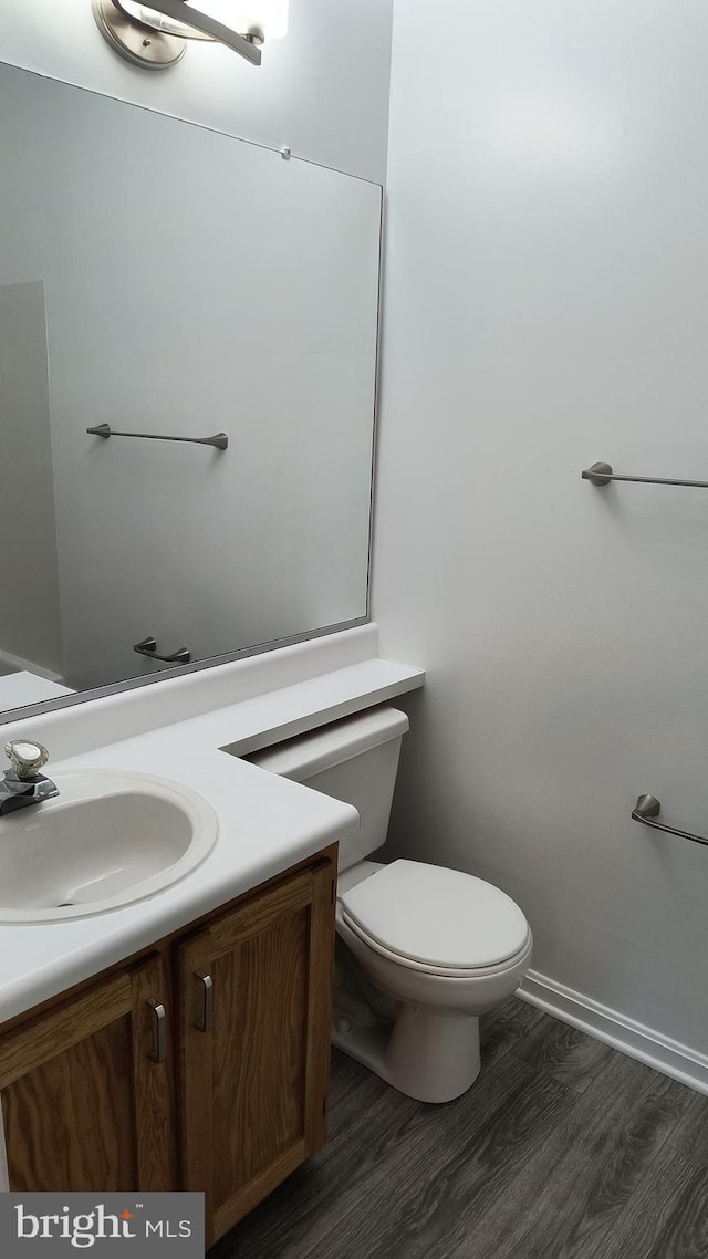 602 Moonglow Rd Unit 202, Odenton, MD 21113 - bathroom with vanity, wood finished floors, toilet, and baseboards