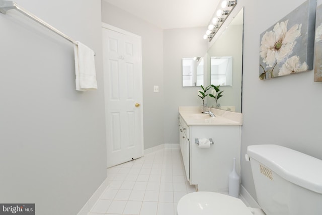 20976 Kittanning Ln, Ashburn, VA 20147 - bathroom with toilet, vanity, baseboards, and tile patterned flooring
