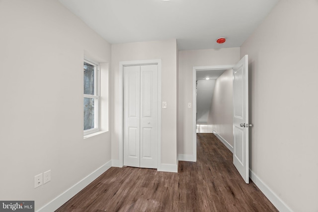 2453 Turner St, Philadelphia, PA 19121 - unfurnished bedroom featuring dark wood-style flooring, baseboards, and a closet