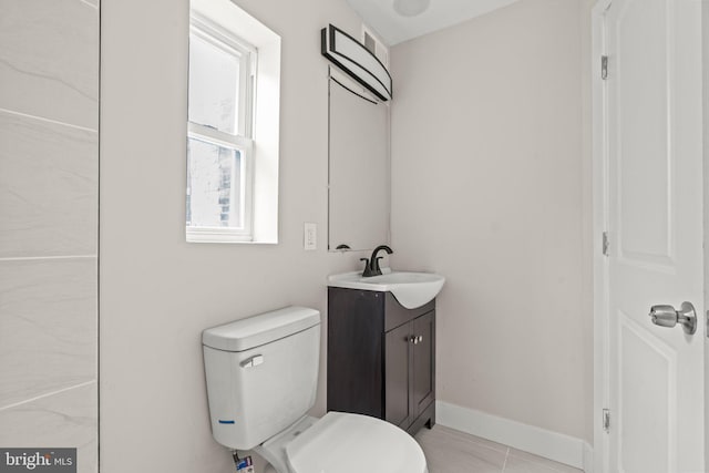 2453 Turner St, Philadelphia, PA 19121 - bathroom featuring vanity, toilet, tile patterned floors, and baseboards