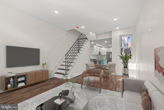 2453 Turner St, Philadelphia, PA 19121 - living area featuring wood finished floors, stairway, recessed lighting, and baseboards
