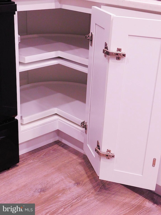 2241 Cartwright Pl, Reston, VA 20191 - detailed view of wood finished floors and white cabinets