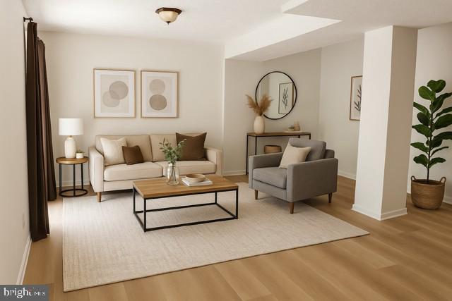 10627 Muirfield Dr, Potomac, MD 20854 - living room with wood finished floors and baseboards