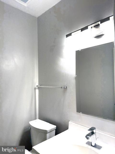 10627 Muirfield Dr, Potomac, MD 20854 - half bath with toilet and vanity