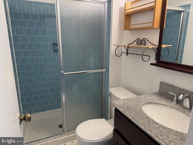 10627 Muirfield Dr, Potomac, MD 20854 - full bath featuring toilet, vanity, and a shower stall