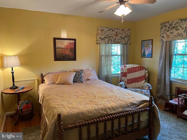 232 N Shore Ct, Seaford, DE 19973 - bedroom with baseboards and ceiling fan