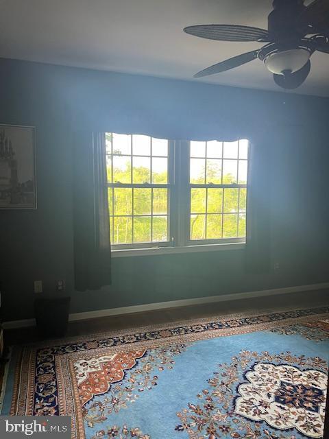 232 N Shore Ct, Seaford, DE 19973 - unfurnished room featuring baseboards, healthy amount of natural light, and a ceiling fan