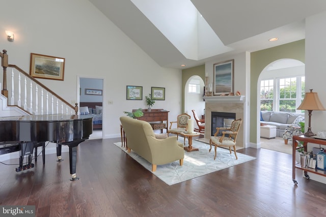 126 Windermere Dr, Palmyra, PA 17078 - living room with a premium fireplace, high vaulted ceiling, stairs, wood finished floors, and recessed lighting