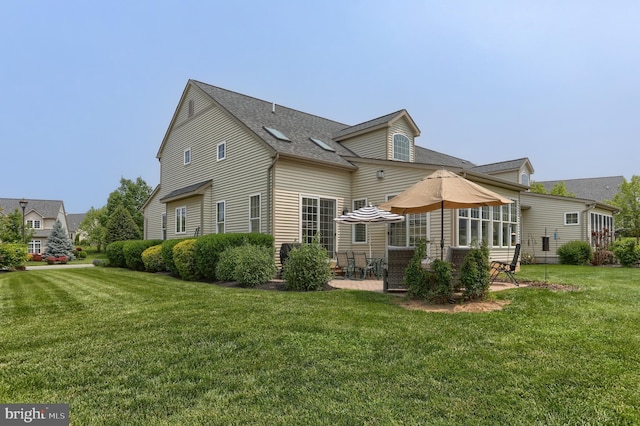 126 Windermere Dr, Palmyra, PA 17078 - back of house featuring a lawn, a patio area, and a shingled roof