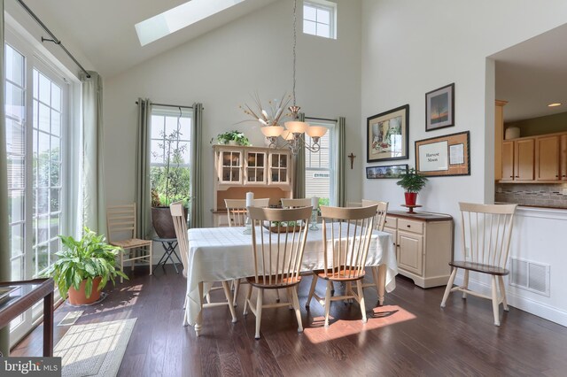 126 Windermere Dr, Palmyra, PA 17078 - dining room featuring a skylight, high vaulted ceiling, dark wood finished floors, and a chandelier