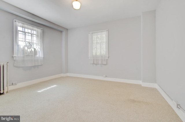 3024 Tilden St NW # 6, Washington, DC 20008 - carpeted spare room featuring radiator and baseboards