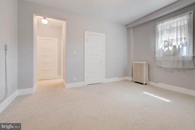 3024 Tilden St NW # 6, Washington, DC 20008 - unfurnished bedroom with radiator heating unit, carpet, and baseboards