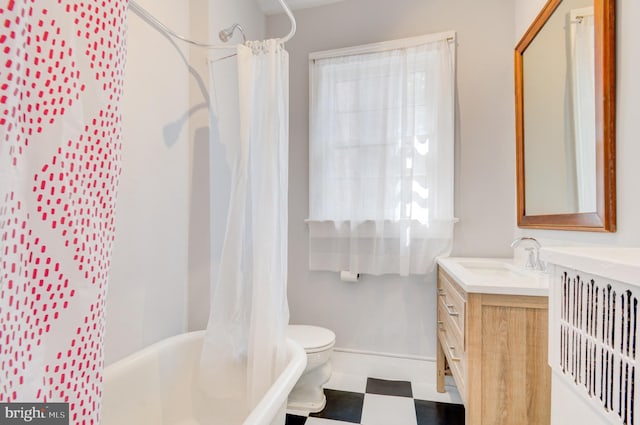 3024 Tilden St NW # 6, Washington, DC 20008 - full bathroom featuring vanity, shower / bath combo, toilet, baseboards, and tile patterned floors