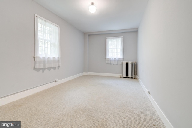 3024 Tilden St NW # 6, Washington, DC 20008 - carpeted spare room featuring radiator and baseboards