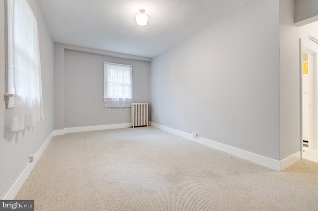 3024 Tilden St NW # 6, Washington, DC 20008 - unfurnished room featuring radiator, light carpet, and baseboards