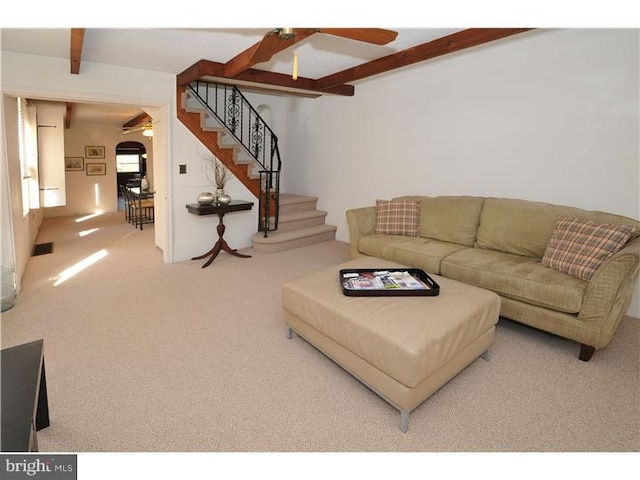 7728 Union Ave, Elkins Park, PA 19027 - living area featuring a ceiling fan, carpet, beam ceiling, and stairway
