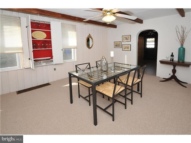 7728 Union Ave, Elkins Park, PA 19027 - carpeted dining room featuring a ceiling fan, arched walkways, and beamed ceiling