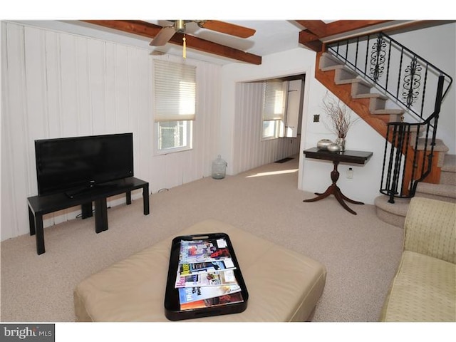 7728 Union Ave, Elkins Park, PA 19027 - living area featuring carpet floors, stairs, ceiling fan, and beam ceiling