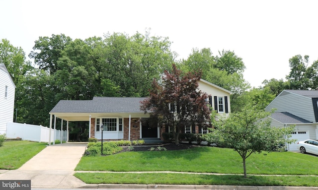 7009 Wood Thrush Dr, Lanham, MD 20706 - view of front of property featuring driveway, brick siding, and an attached carport