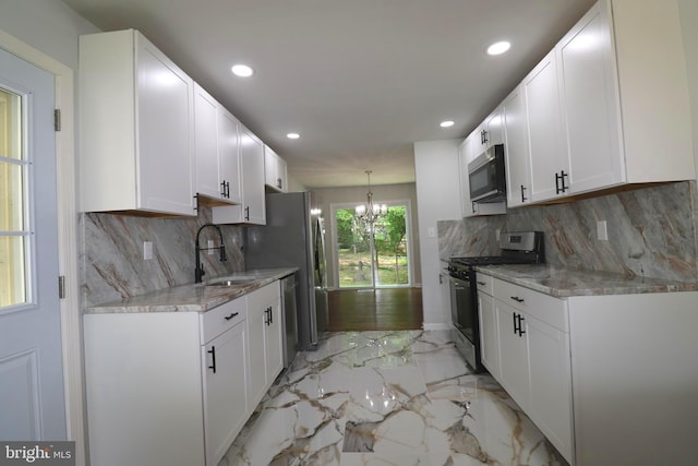 7009 Wood Thrush Dr, Lanham, MD 20706 - kitchen featuring appliances with stainless steel finishes, a sink, recessed lighting, white cabinetry, and decorative backsplash