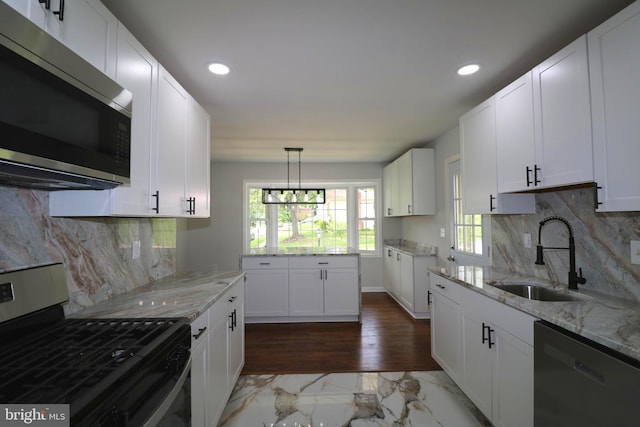 7009 Wood Thrush Dr, Lanham, MD 20706 - kitchen featuring appliances with stainless steel finishes, a sink, marble look tiles, recessed lighting, and light stone countertops