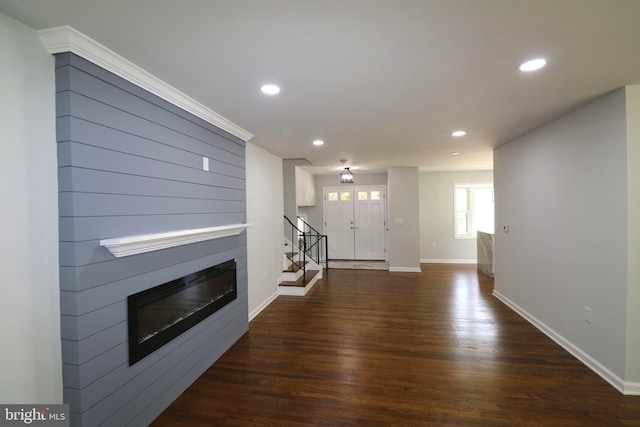 7009 Wood Thrush Dr, Lanham, MD 20706 - unfurnished living room featuring a glass covered fireplace, dark wood-type flooring, stairway, baseboards, and recessed lighting