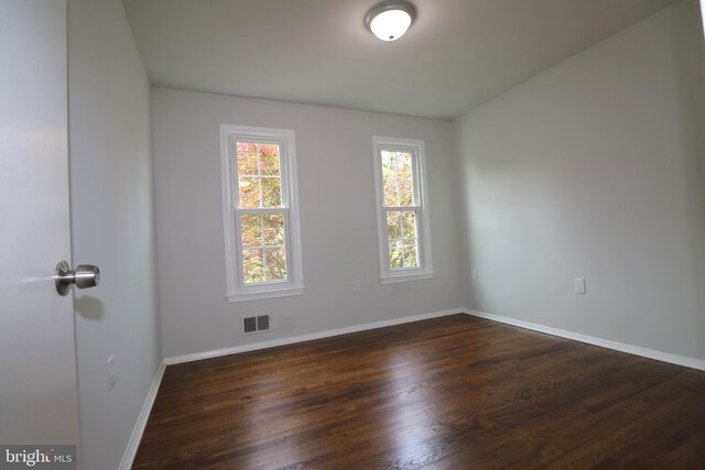 7009 Wood Thrush Dr, Lanham, MD 20706 - empty room featuring dark wood finished floors and baseboards