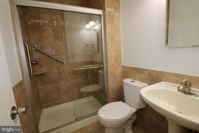7009 Wood Thrush Dr, Lanham, MD 20706 - bathroom with a stall shower, a sink, toilet, and tile walls
