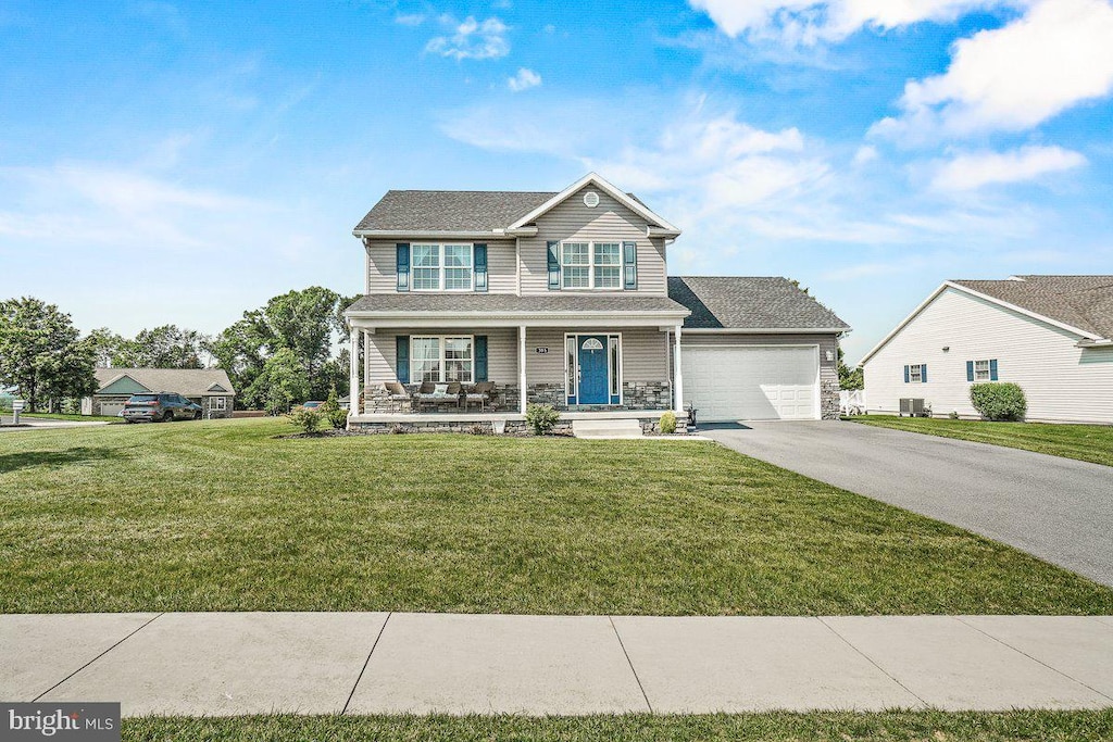 385 Blue Bird Trl, Greencastle, PA 17225 - traditional home featuring driveway, a porch, an attached garage, a front yard, and cooling unit