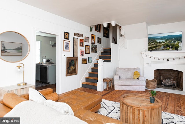 510 E Main St, Birdsboro, PA 19508 - living room featuring stairs, a fireplace, and wood finished floors