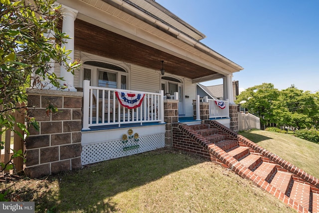 510 E Main St, Birdsboro, PA 19508 - shotgun-style home featuring a porch and a front lawn