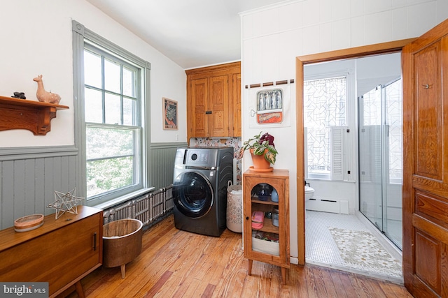 510 E Main St, Birdsboro, PA 19508 - laundry area featuring washer / clothes dryer, light wood finished floors, cabinet space, wainscoting, and plenty of natural light