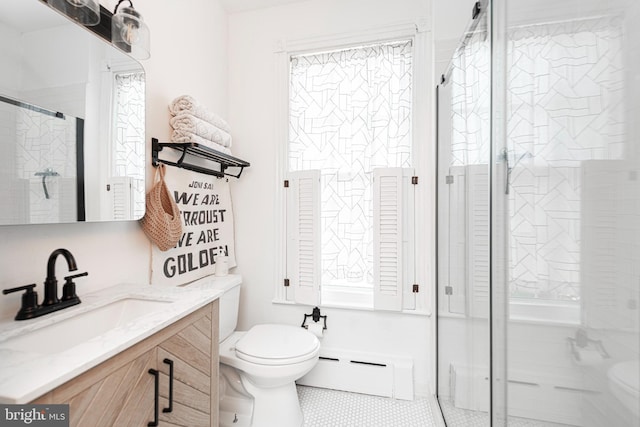 510 E Main St, Birdsboro, PA 19508 - bathroom featuring toilet, a baseboard heating unit, plenty of natural light, and vanity