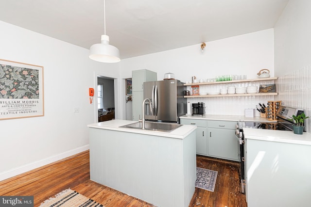 510 E Main St, Birdsboro, PA 19508 - kitchen featuring appliances with stainless steel finishes, a sink, backsplash, dark wood finished floors, and light countertops