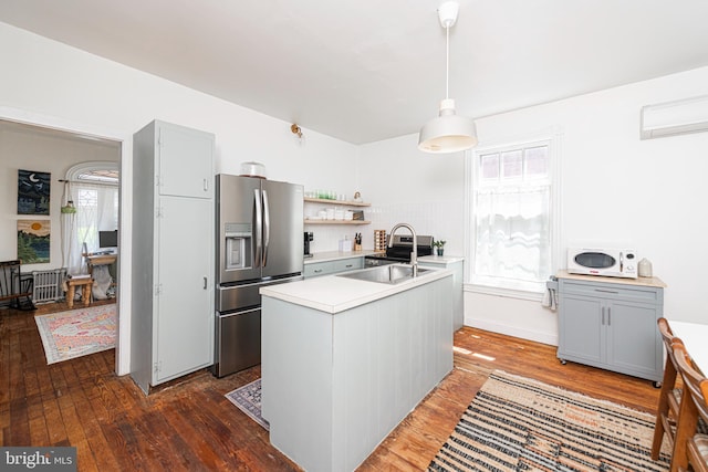 510 E Main St, Birdsboro, PA 19508 - kitchen with stainless steel fridge with ice dispenser, light countertops, hardwood / wood-style floors, and healthy amount of natural light