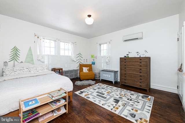 510 E Main St, Birdsboro, PA 19508 - bedroom featuring a wall mounted AC, multiple windows, wood finished floors, and baseboards