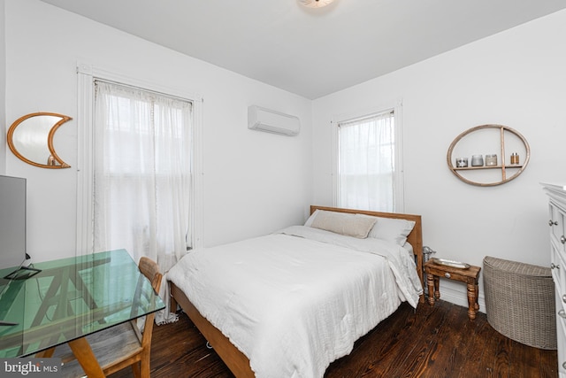 510 E Main St, Birdsboro, PA 19508 - bedroom with dark wood-style floors and a wall mounted AC