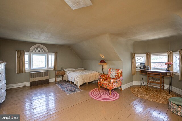 510 E Main St, Birdsboro, PA 19508 - bedroom with radiator, wood-type flooring, vaulted ceiling, and baseboards