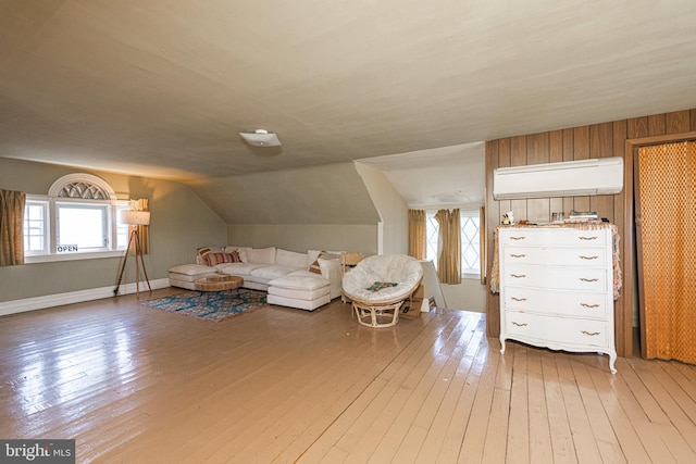 510 E Main St, Birdsboro, PA 19508 - living room featuring a wall mounted AC, hardwood / wood-style flooring, lofted ceiling, and baseboards