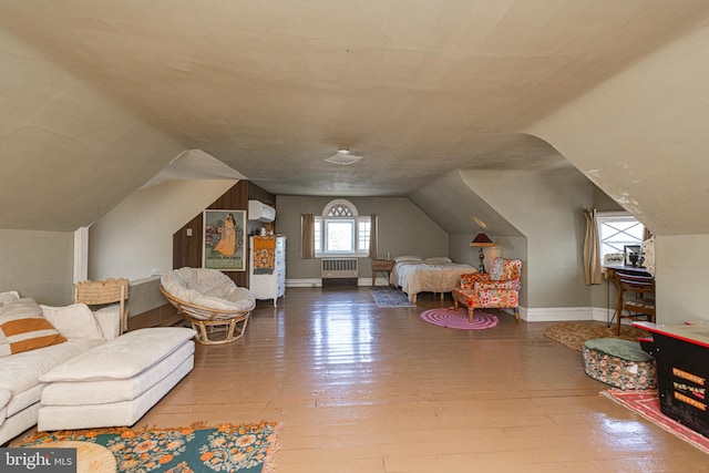 510 E Main St, Birdsboro, PA 19508 - bedroom with radiator, lofted ceiling, hardwood / wood-style floors, baseboards, and an AC wall unit