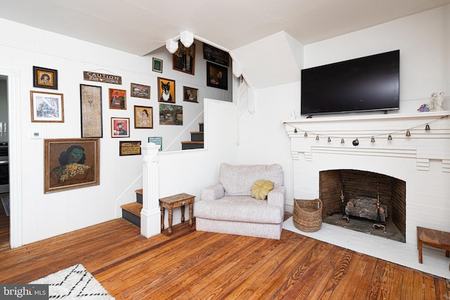 510 E Main St, Birdsboro, PA 19508 - living room featuring wood finished floors, stairs, and a fireplace with flush hearth