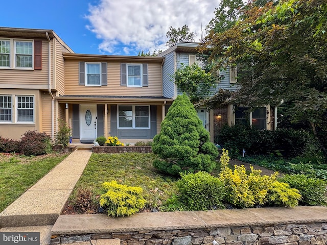 12306 Quail Woods Dr, Germantown, MD 20874 - view of front of house with covered porch and a front lawn