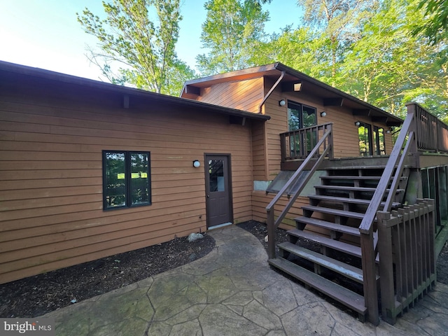 1780 Twirly Ct, Prince Frederick, MD 20678 - view of exterior entry featuring a deck and a patio area