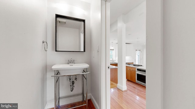 225 Dupont Cir, Wilmington, DE 19809 - bathroom featuring wood finished floors and a sink