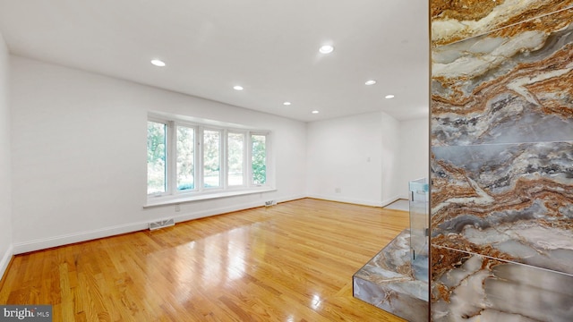 225 Dupont Cir, Wilmington, DE 19809 - empty room with wood finished floors and recessed lighting