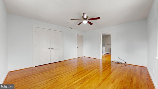 225 Dupont Cir, Wilmington, DE 19809 - unfurnished bedroom with light wood-style flooring, a closet, and a ceiling fan